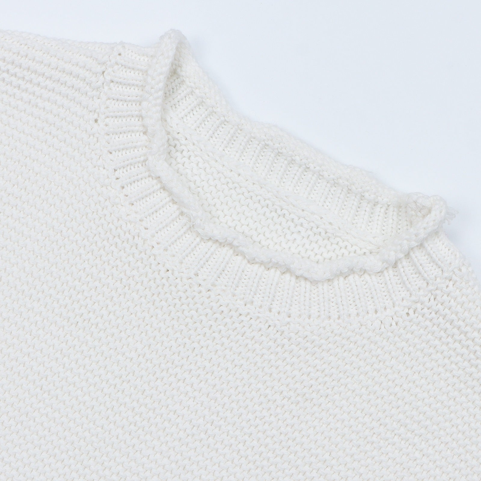 Rolled crew neckline detail on the Bubs on Cloud 100% cotton knit toddler sweater.